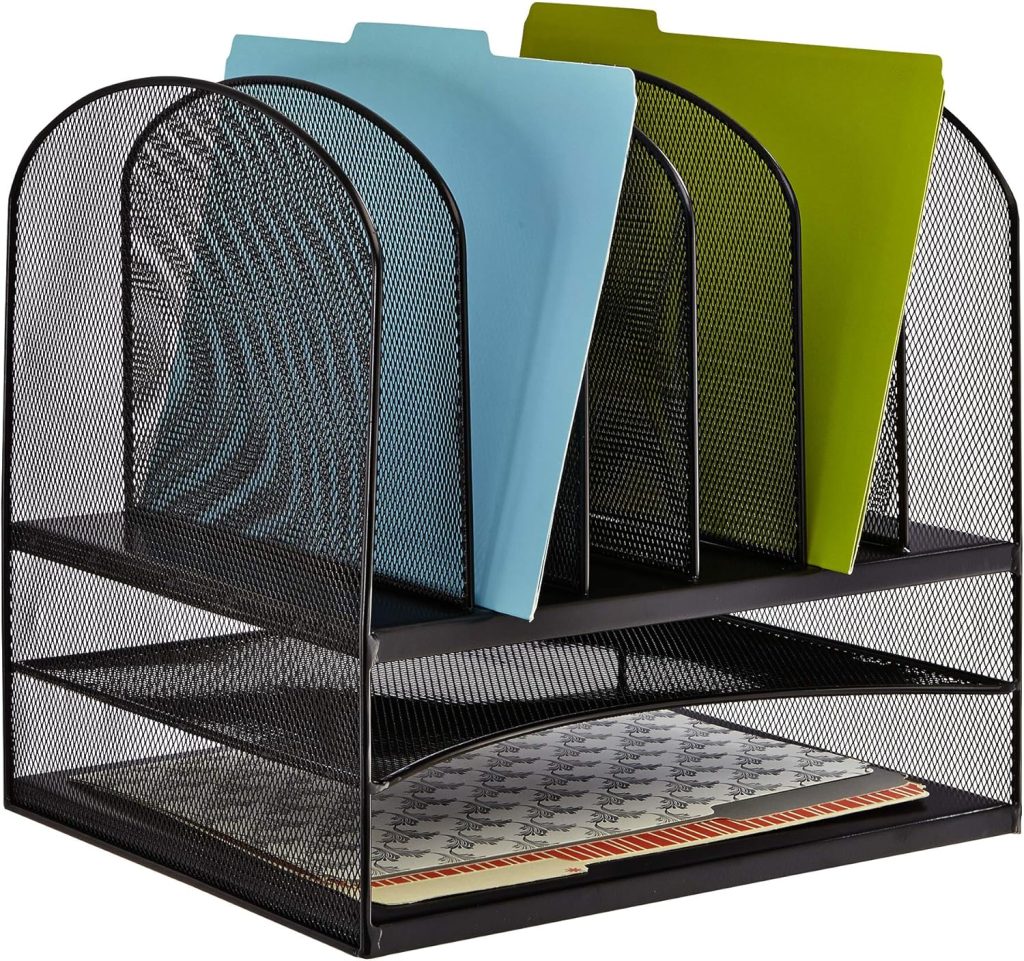 Black mesh desktop organizer styled on a gray home office desk with ergonomic chair, LED lamp, triptych wall art, and neutral office decor.