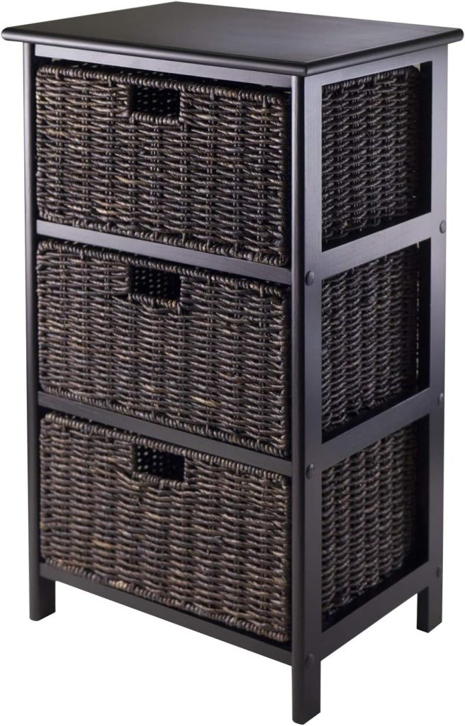 Winsome stackable storage basket styled in a modern bathroom with wood vanity, grey bathroom rugs, floating shelves, towels, scented candle, and neutral spa decor.