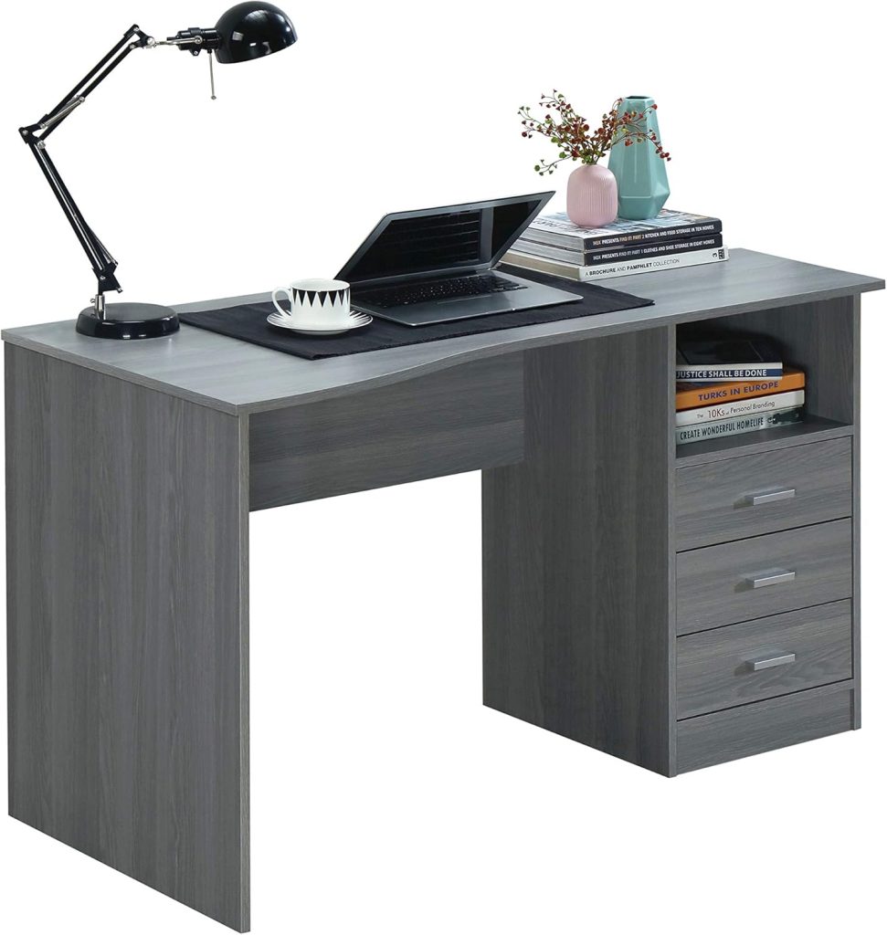 Gray computer desk with drawers styled in a modern home office with ergonomic chair, wall art, lamp, storage, and neutral decor.
